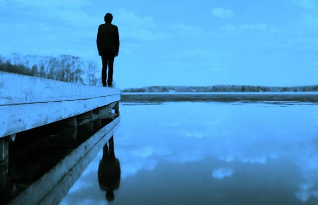 Solitary Figure on a Dock